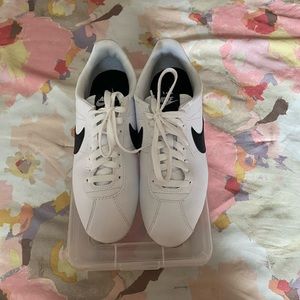 Who’re and black check Nike Cortez